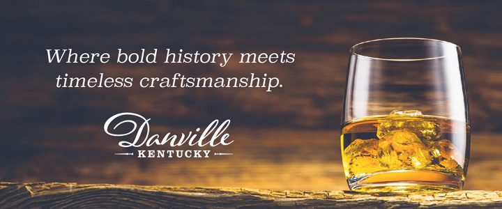 A glass of bourbon on the rocks with a golden hue and the text Where bold history meets timeless craftsmanship Danville Kentucky
