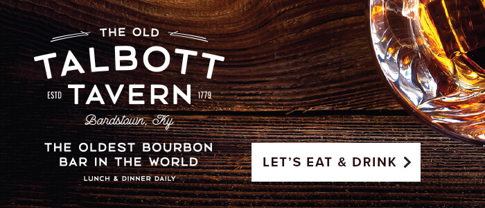 A wood grain surface and cocktail with the text The Old Talbott Tavern, the Oldest Bourbon Bar in the World